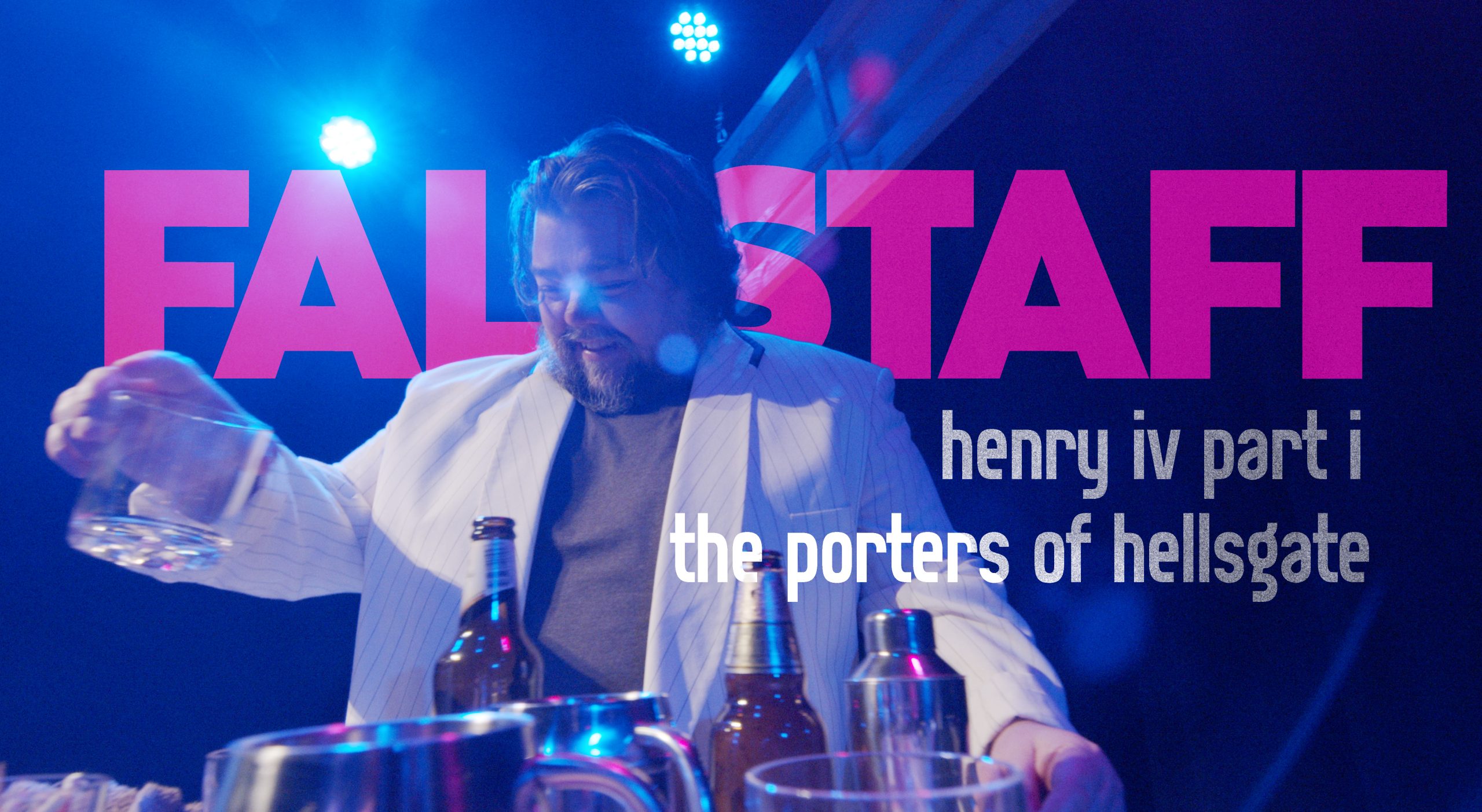 The image features a person wearing a white jacket with a relaxed expression, standing behind a table with several bottles and a glass. Bright blue stage lights illuminate the scene, creating a vibrant atmosphere. Large, bold text in bright pink reads "FALSTAFF," while smaller white and gray text indicates "henry iv part i" and "the porters of hellsgate." The overall design suggests a lively, modern production of Shakespeare's play Henry IV Part 1, with a focus on the character of Falstaff.